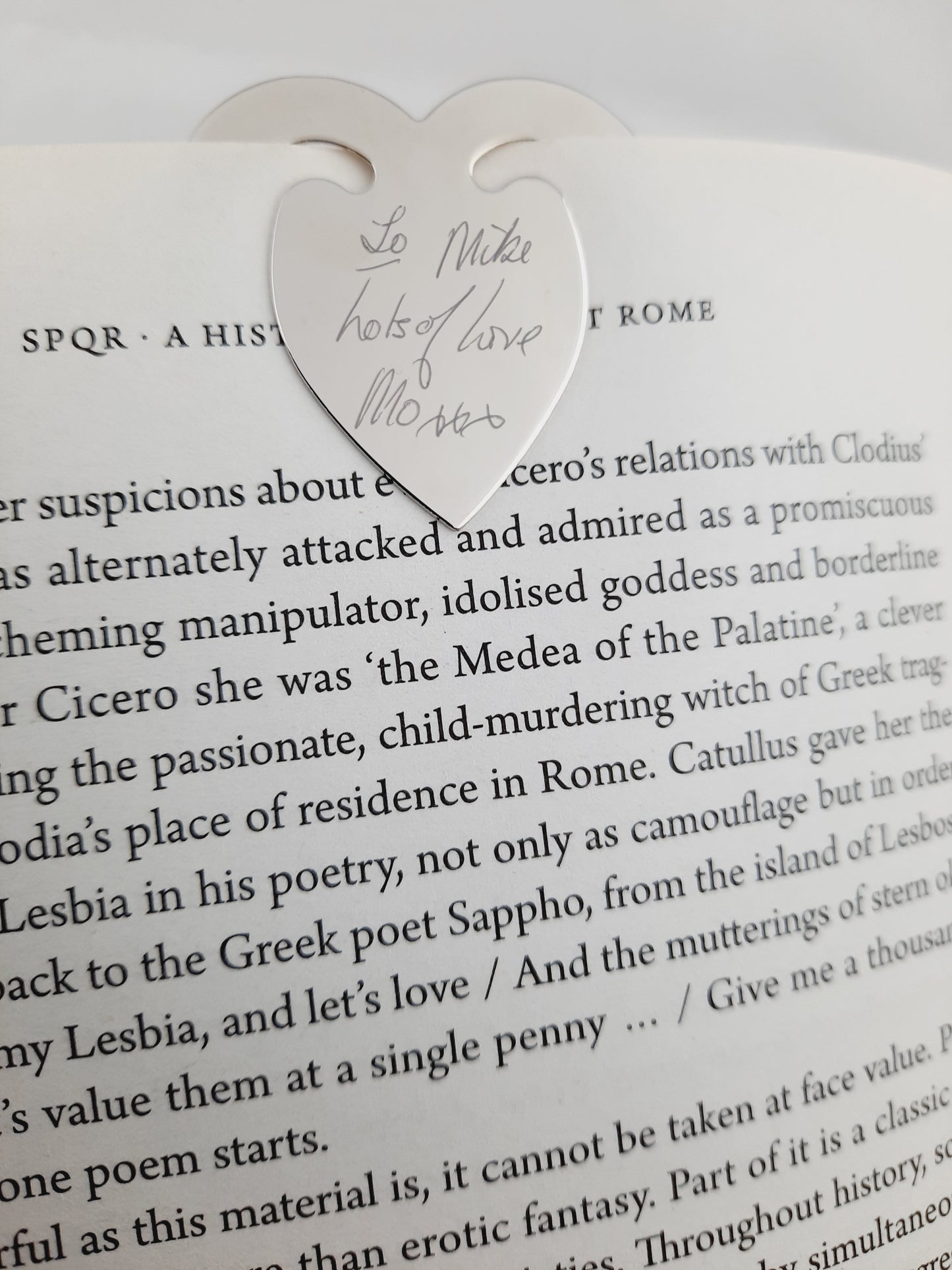 Personalised Engraved Bookmark Love Heart Shaped handwriting that says "To Mike Lots of Love Mo xxx"