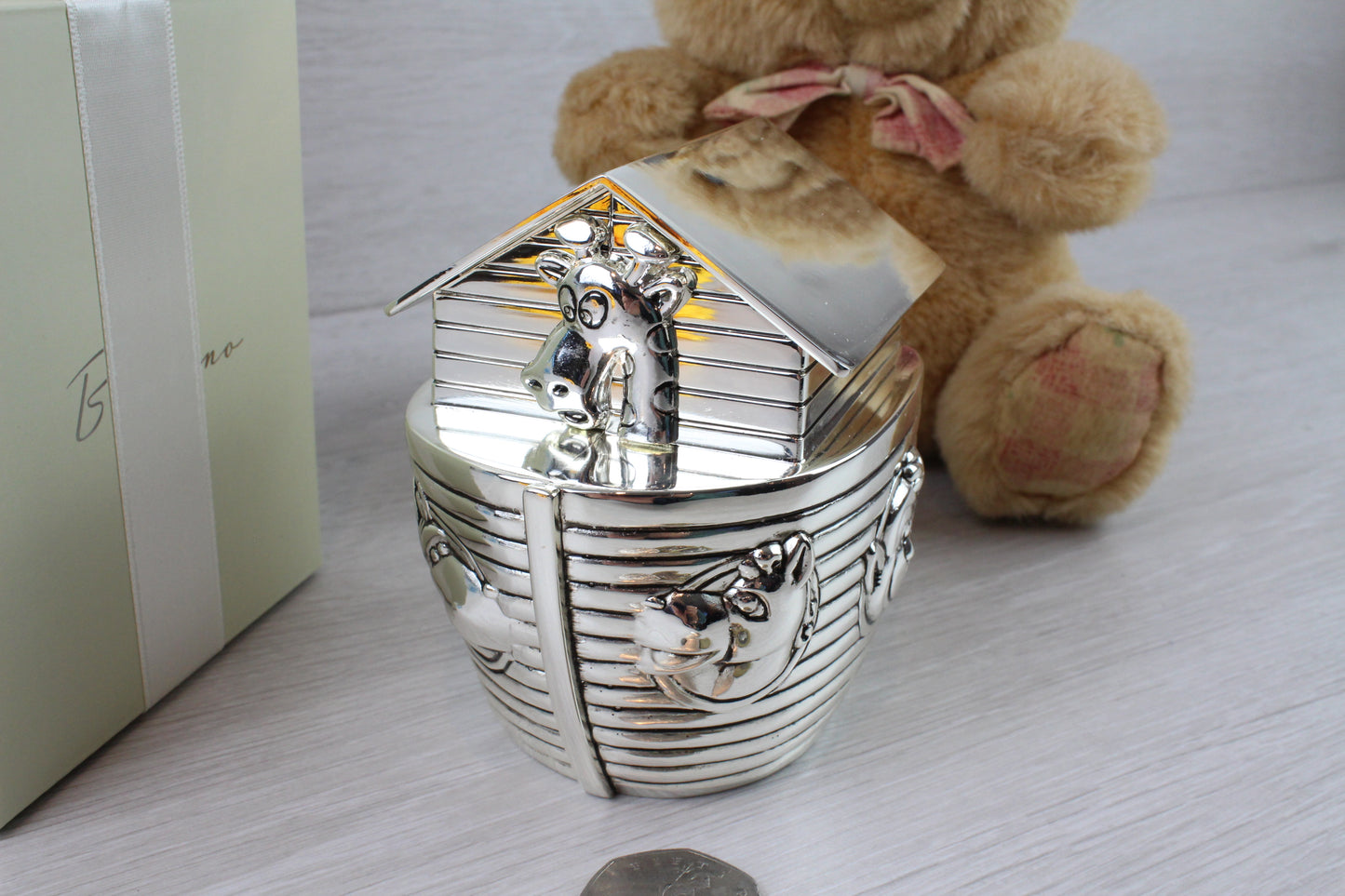 Showing the back side of Noah's Ark Money Box with tiger design and some animals.