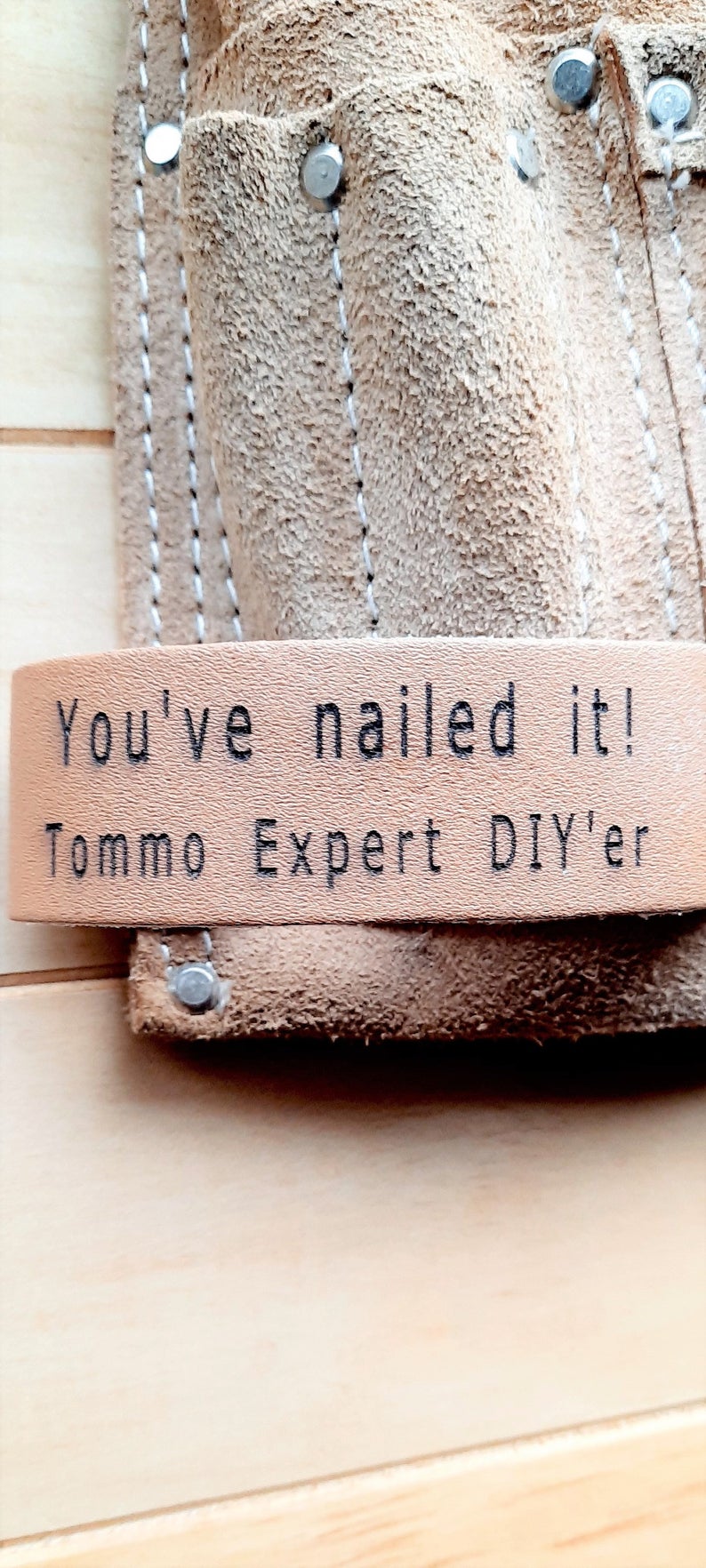 Engraved leather tool loop on belt