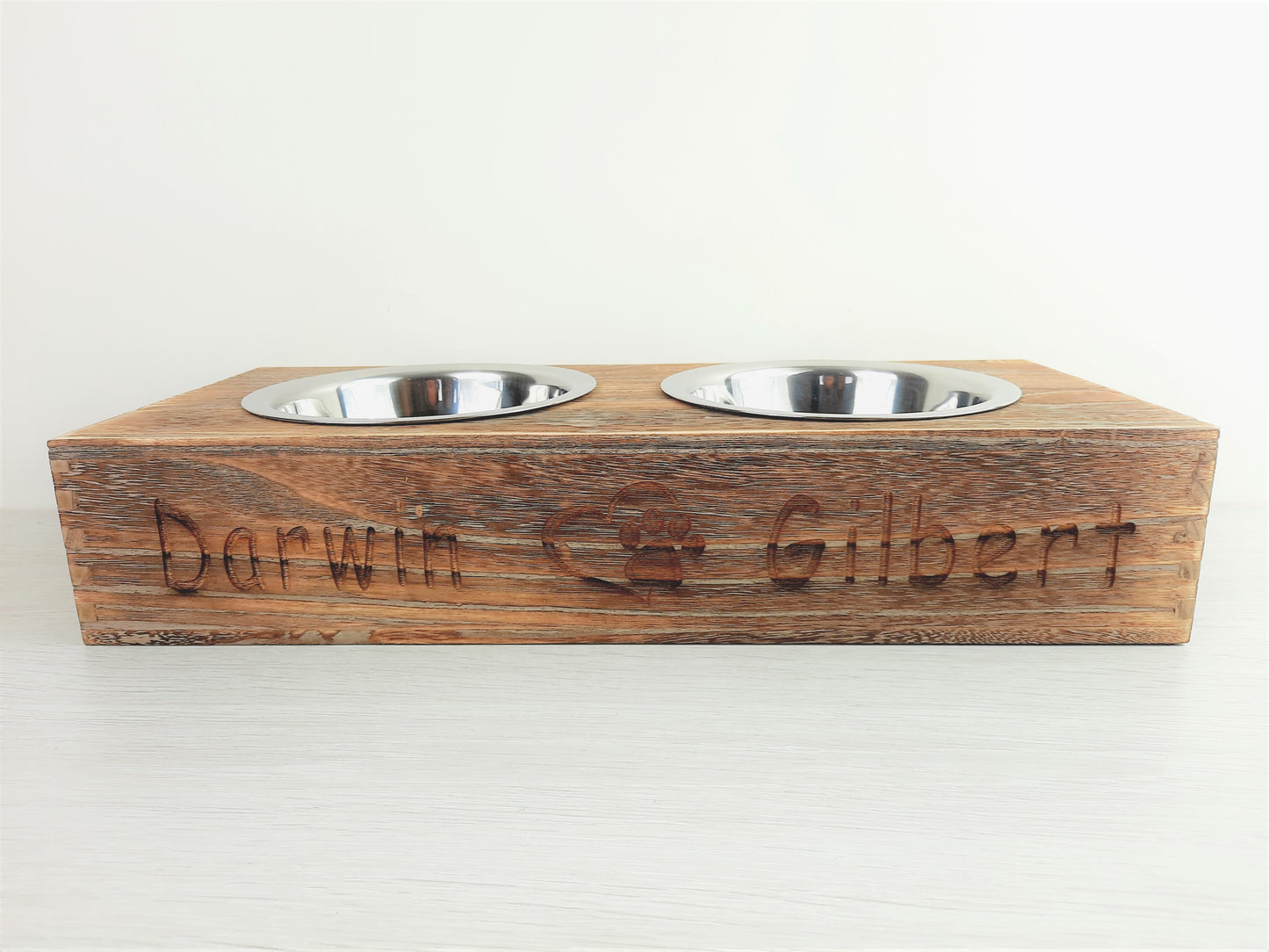 Personalised Pet Bowl Feeder Bamboo Wood with engraved 2 pet names that says "Darwin" Paw with heart icon " Gilbert".