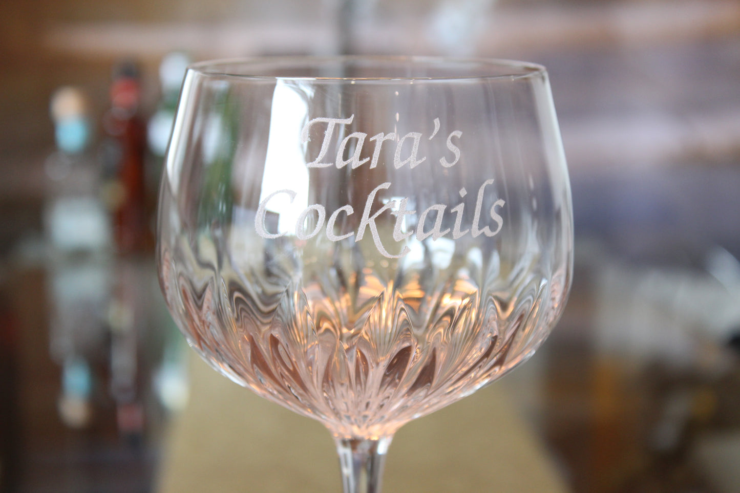 Personalised crystal cut gin glass details.