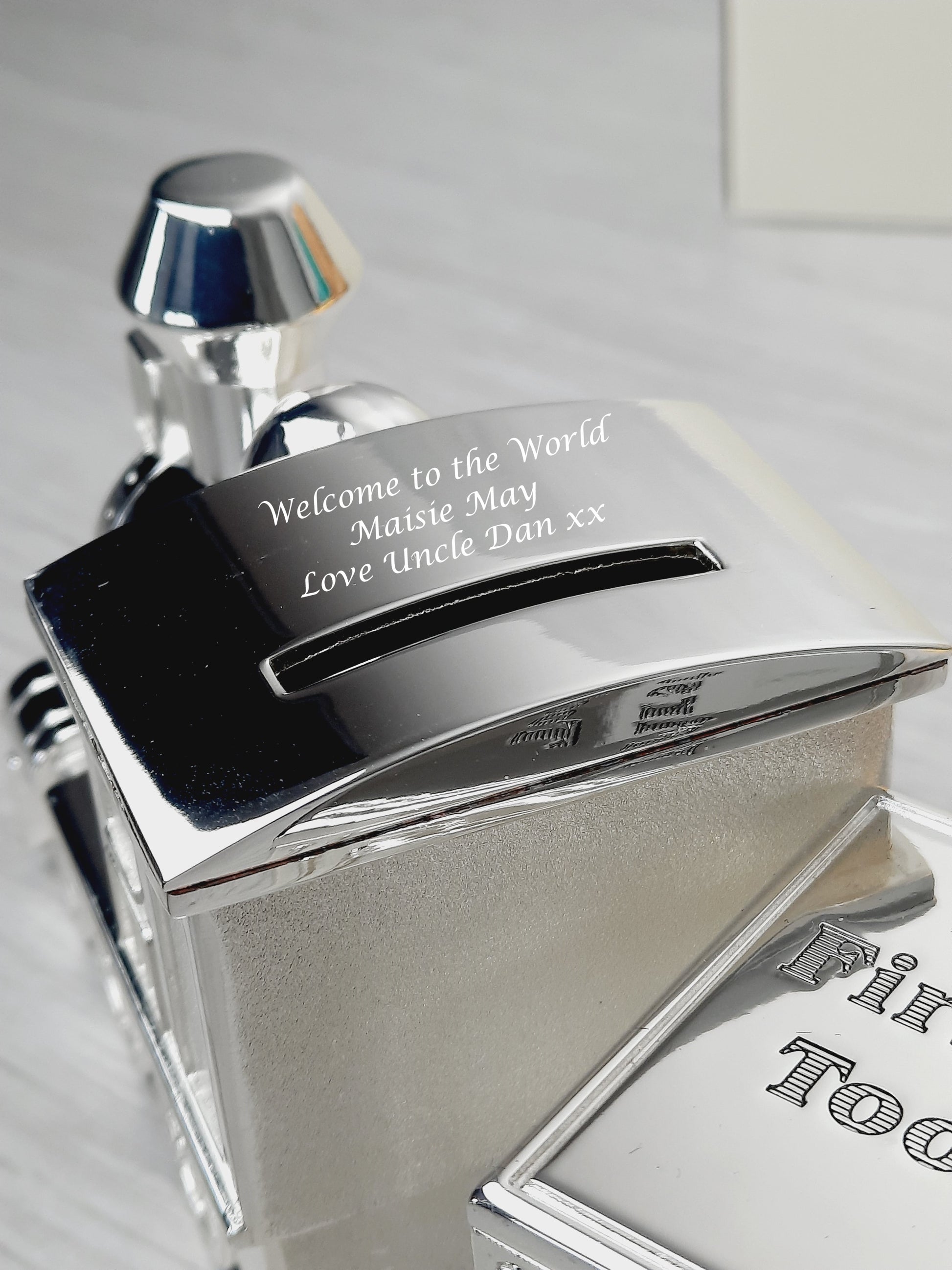 Personalised Engraved Money Box that says "Welcome to the World Maisie May Love Uncle Dan xx"