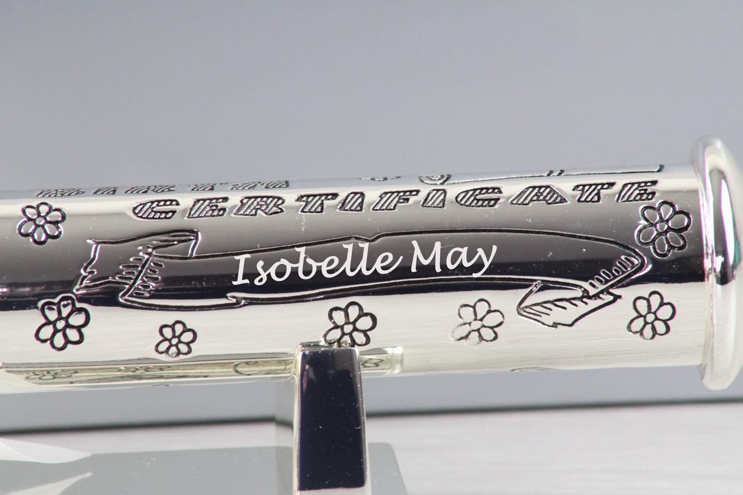 Below "BIRTH CERTIFICATE" engraved and flowers, there's also a personalised child's name "Isobelle May" on the holder.
